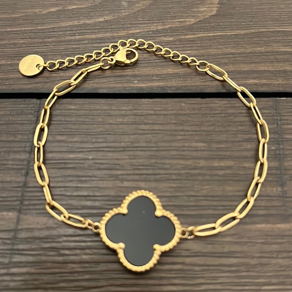 Jewelry - GOLD STAINLESS STEEL BRACELET WITH BLACK FOUR LEAF CLOVER